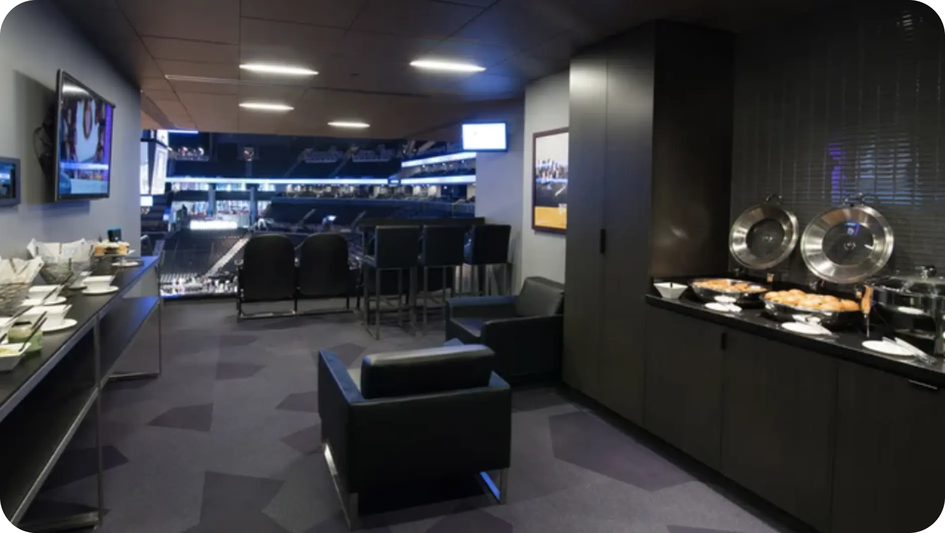 A well-furnished room with a prominent large television and a sophisticated buffet, ideal for gatherings.