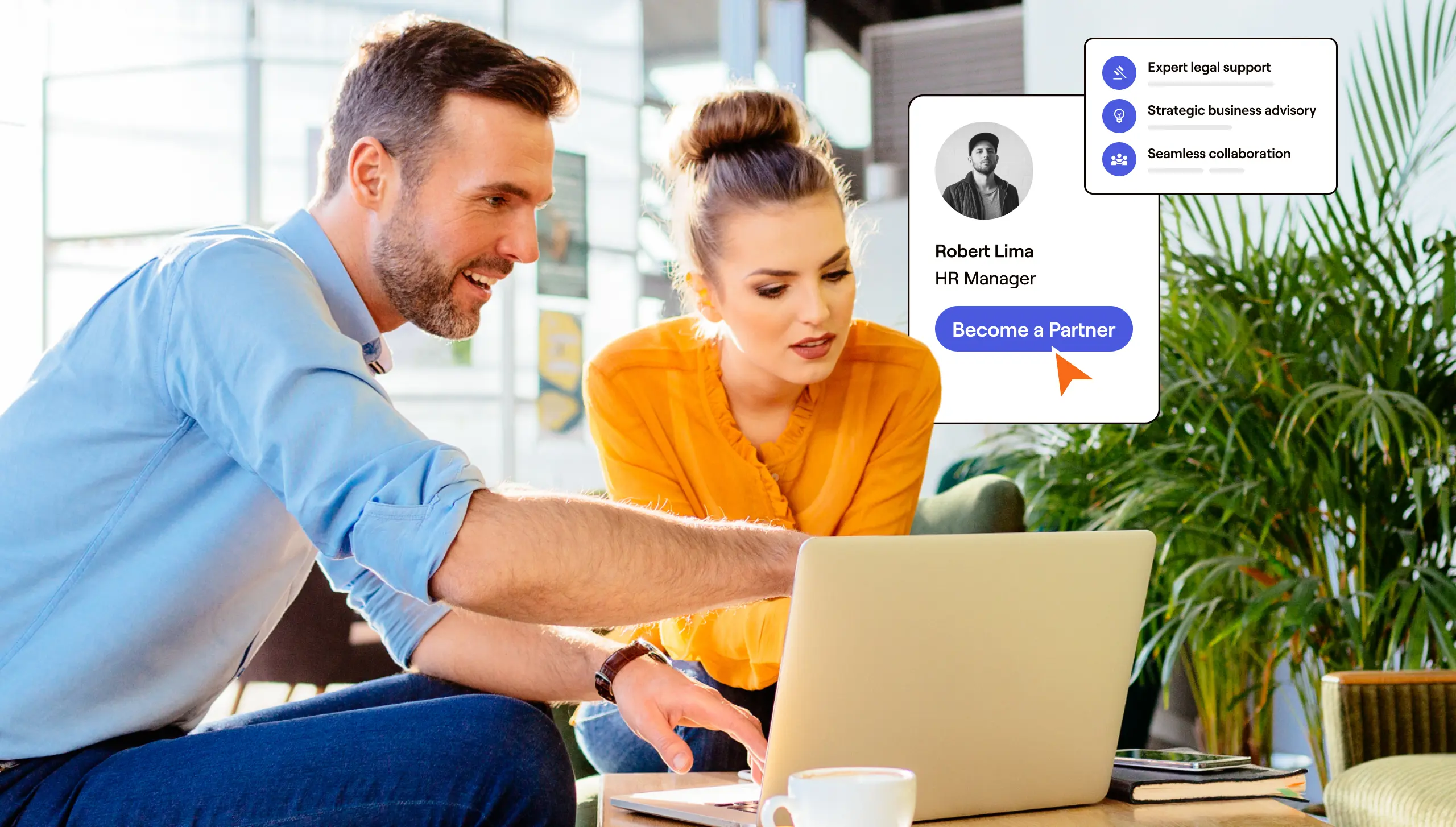 A man and woman are focused on a laptop screen, engaged in discussion or collaboration.